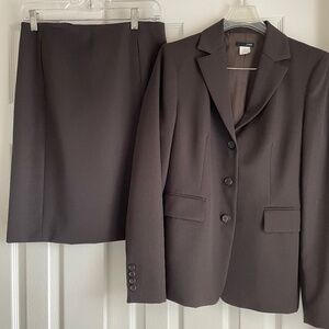 Never worn JCrew suit (jacket & skirt). Dark brown.